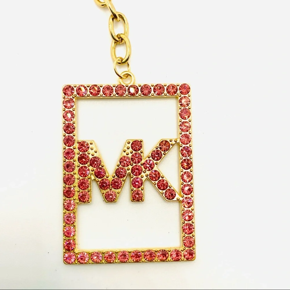 Purse Charm Key Chain MK Pink Crystals set in golden tone. BRAND NEW